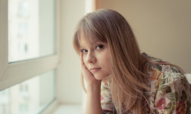 young-woman-window